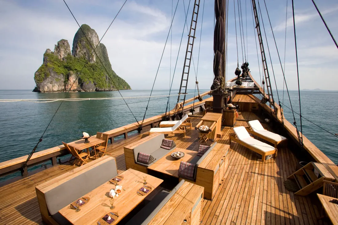 Silolona’s timber deck and rigging overlooking limestone islands