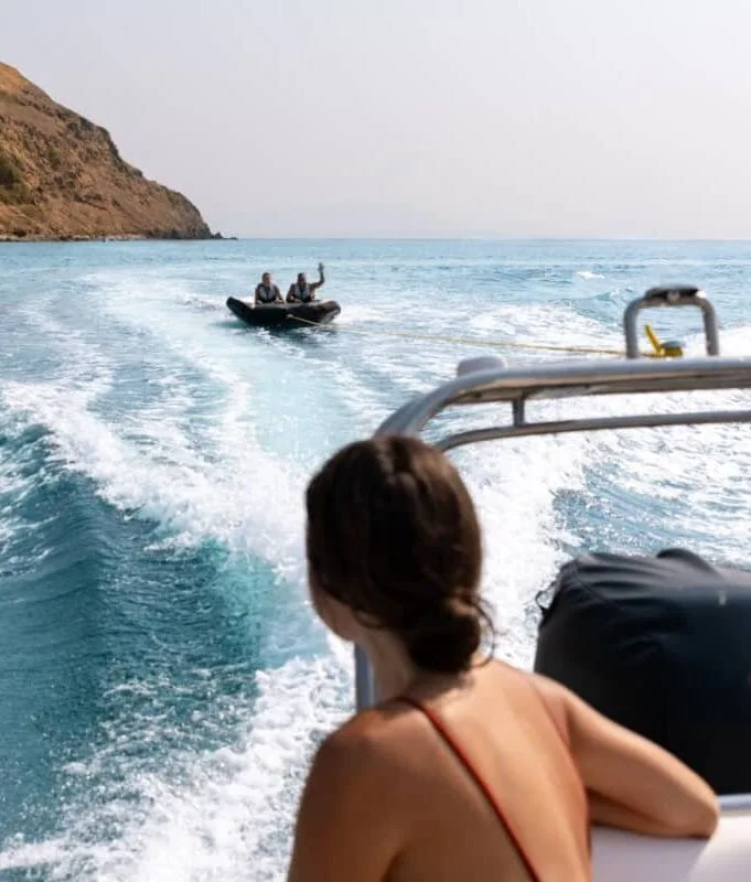 Guests travelling by tender beside an island coastline in Komodo